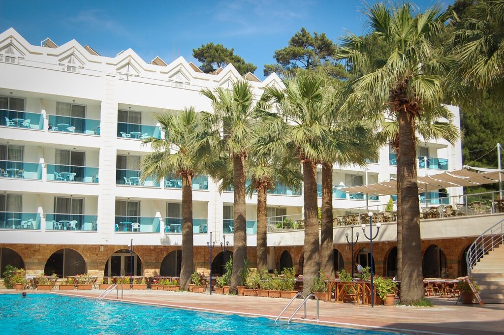swimming pool, palm trees, hotel-428591.jpg